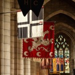 Historic colours hang in Hexham Abbey's nave 2